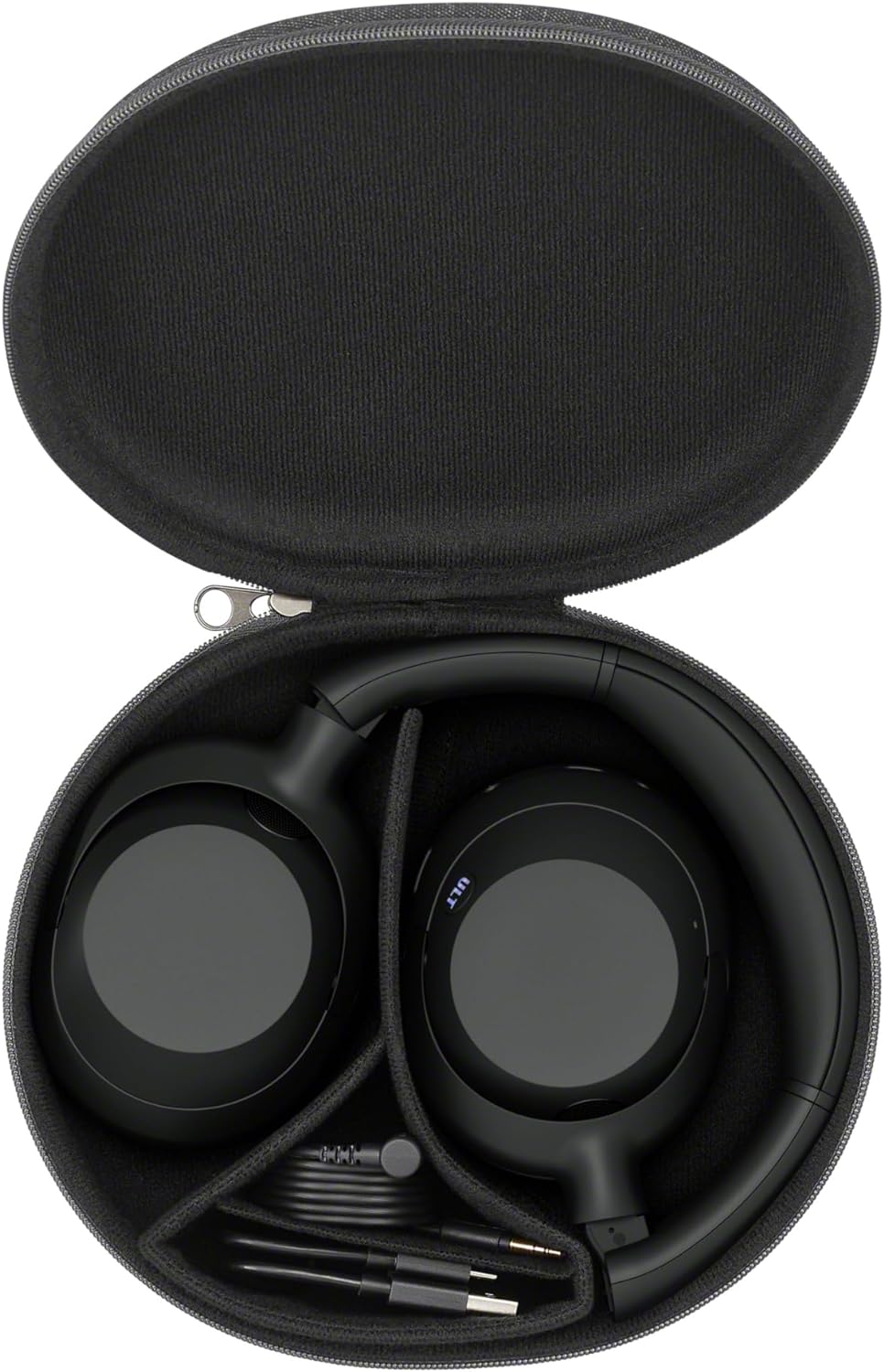 The image shows a pair of Sony Ult Wear headphones placed inside a protective carrying case. The case is unzipped and open, revealing the headphones, which are black. They're neatly tucked into molded compartments designed to fit their shape. Also visible in the case is a compartment holding cables, likely for charging and possibly for connecting the headphones with an audio jack to a device for wired listening. The design suggests these are likely high-quality headphones, often used for an enhanced audio experience, and the case provides protection during travel or storage.