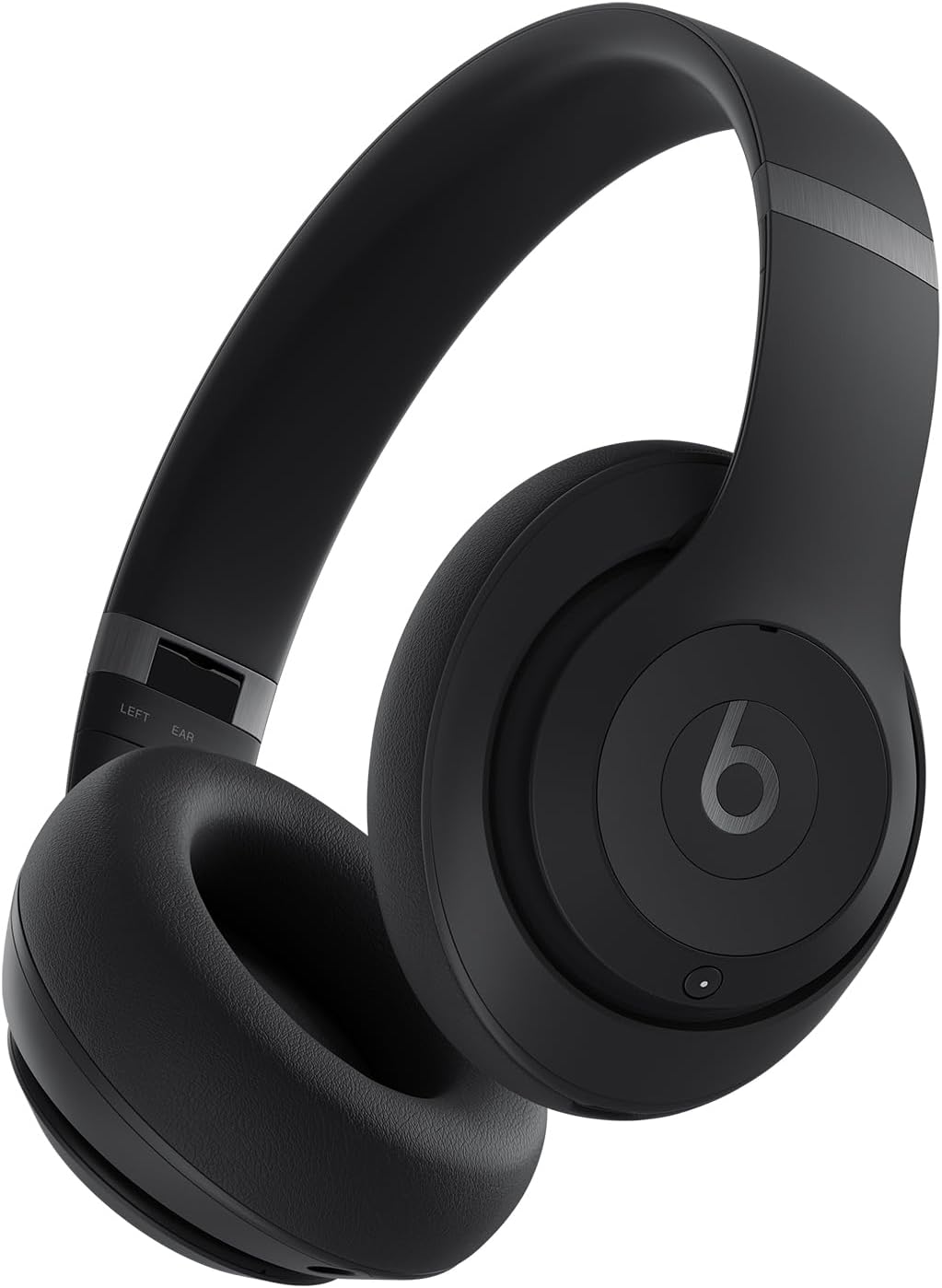 This image shows a pair of Beats Studio Pro headphones. They are black, featuring a contemporary design with cushioned ear cups for comfort, and a headband that connects the two earpieces.