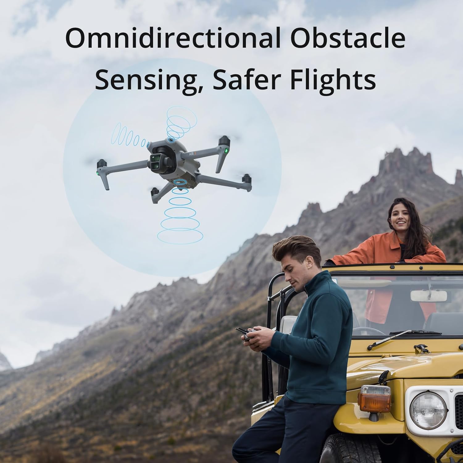 The image features an advertisement or promotional graphic for a DJI Air 3 equipped with omnidirectional obstacle sensing for safer flights. At the center of the image, there is a drone surrounded by a circular graphic that likely represents the obstacle sensing feature, visualized as blue concentric circles or waves emanating from the drone.

In the foreground, there are two people interacting with the drone. On the left, a person is standing next to a bright yellow vehicle and seems to be operating the drone with a remote control device, while on the right side, another person is emerging from the vehicle and appears to be looking at the drone in flight, probably admiring its capabilities. The setting suggests an outdoor, mountainous area, which points to the drone's potential use in exploration or capturing scenic beauty during travels.