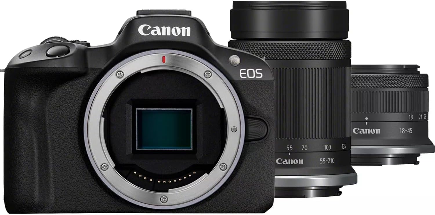 The image shows a digital single-lens reflex camera (DSLR) by Canon from the EOS series, with the lens removed, displaying the camera body and sensor. Alongside the camera body, there are two lenses. The lens on the left is typically a telephoto zoom lens with focal lengths etched on the barrel ranging from 55 to 210 millimeters. The lens on the right appears to be a standard zoom lens with a focal length range from 18 to 45 millimeters. These lenses are designed to be interchangeable and used with the camera body shown.